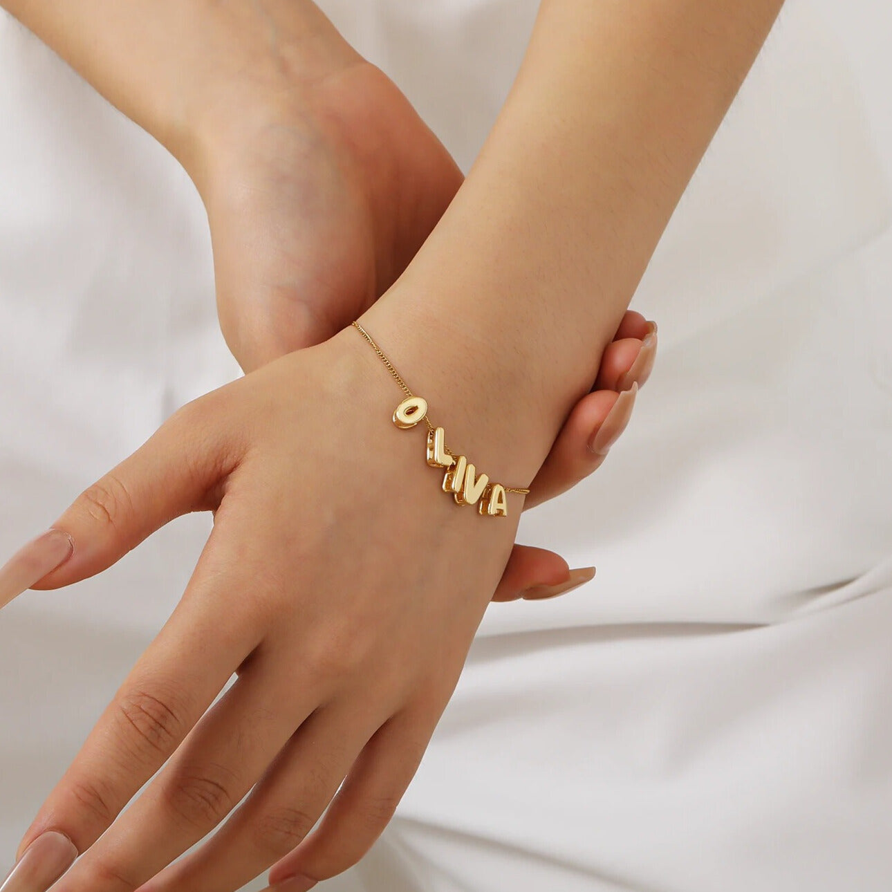 Image of the trending jewelry collection, featuring the Signature Clover Necklace with clover-shaped letter pendants, surrounded by complementary custom jewelry pieces