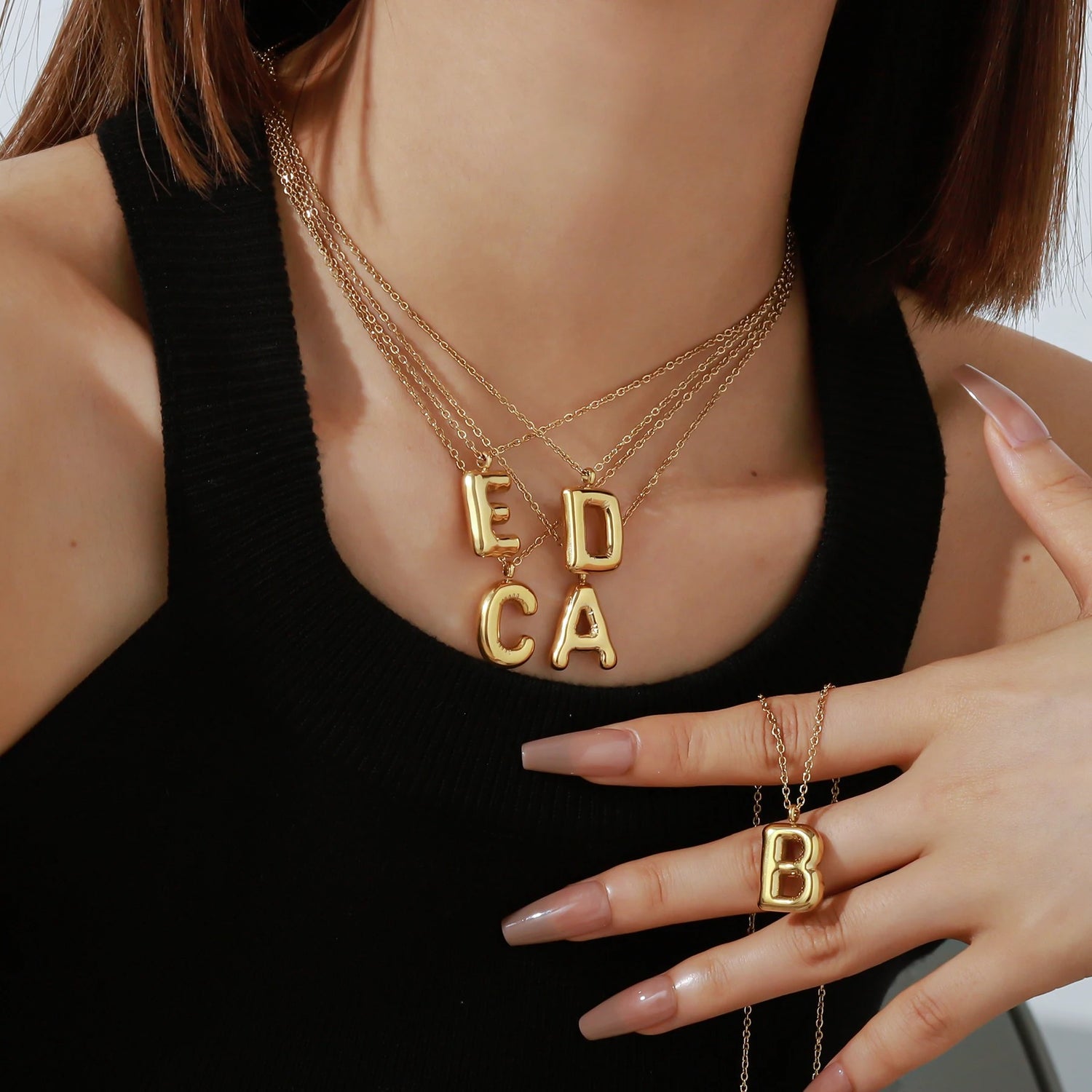 Collection of initial necklaces by Camden Customs. Stylish and customizable pieces perfect for layering or wearing solo to express your unique style.
