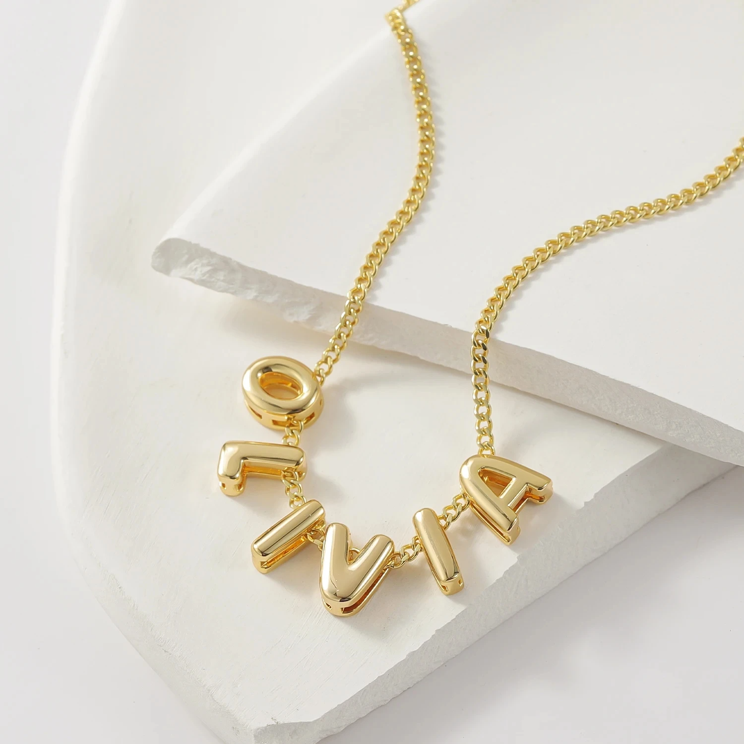 Front view of the Classic Bubble Letters Name Necklace showcasing bold and stylish bubble-lettering in a timeless design