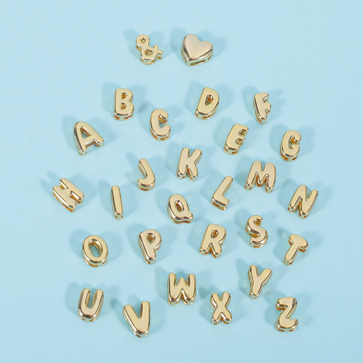 Close-up of individual letters from the Classic Bubble Letters Name Necklace, highlighting the bold, bubble-style design of each letter.